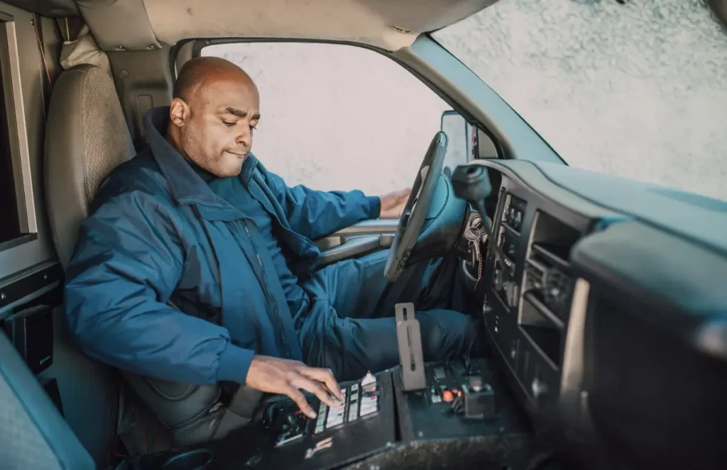 Driver adjusting dashboard controls.